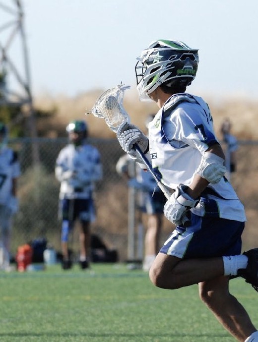 John Larson carrying the ball at speed in his Seattle Starz uniform